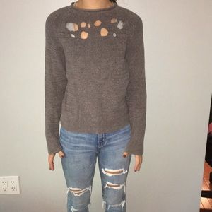 Cute sweater with trendy holes